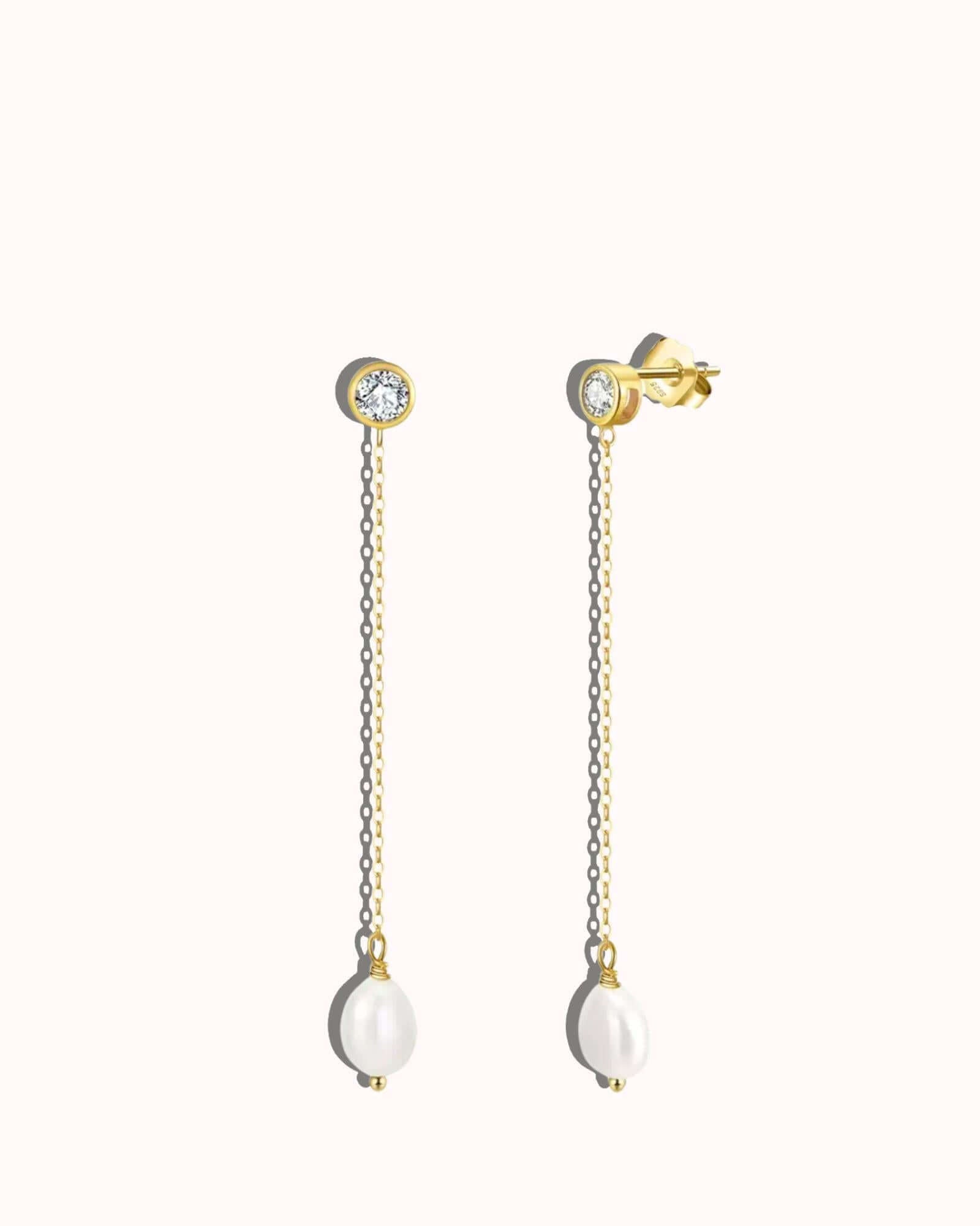 Elegant pearl zirconia drop earrings in gold with a modern design for versatile styling.