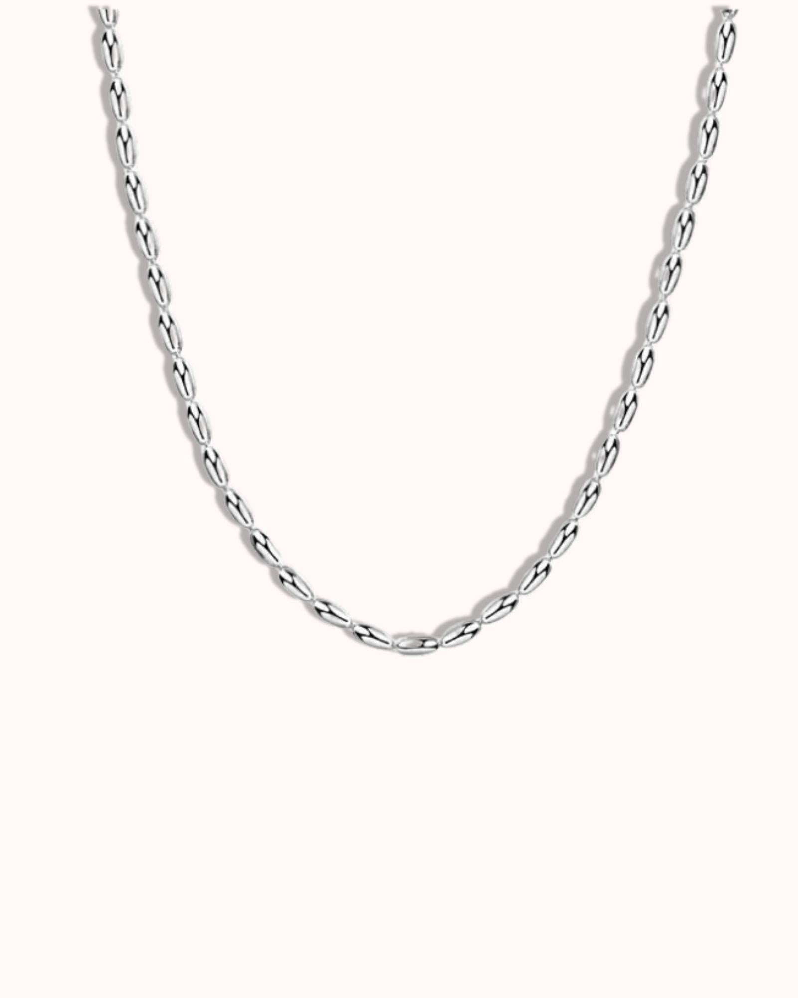 Simple Oval Bead Chain in Silver featuring smooth oval beads for a classic and versatile look.