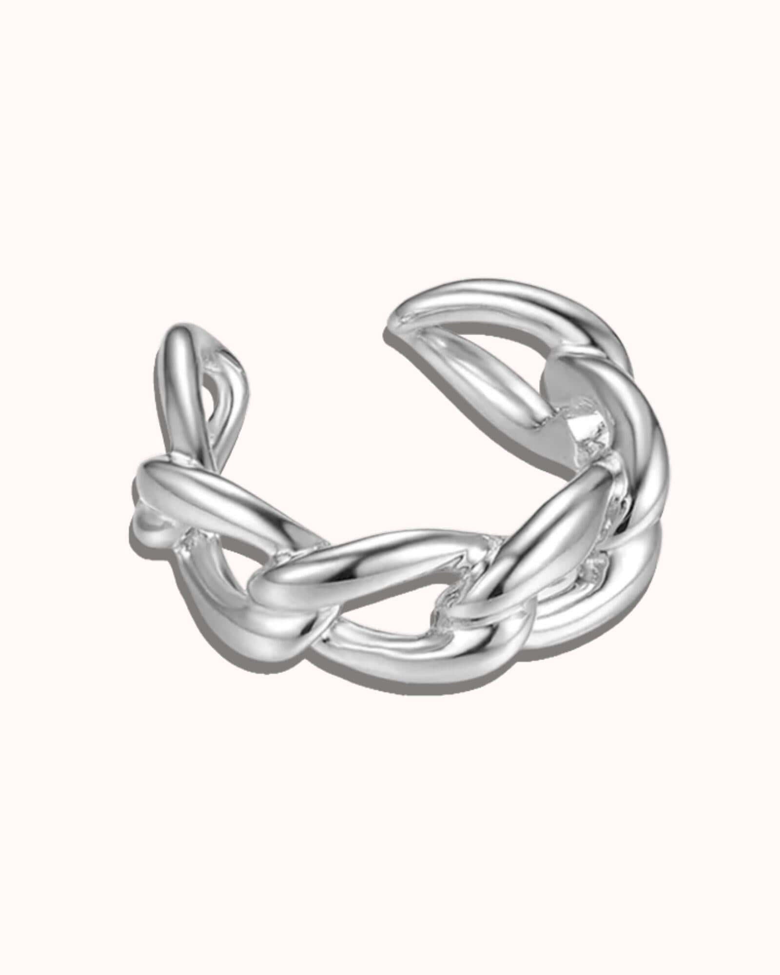 Silver knotted ring on a white background