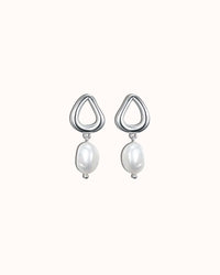 Pair of silver earrings with pearl drops on a white background