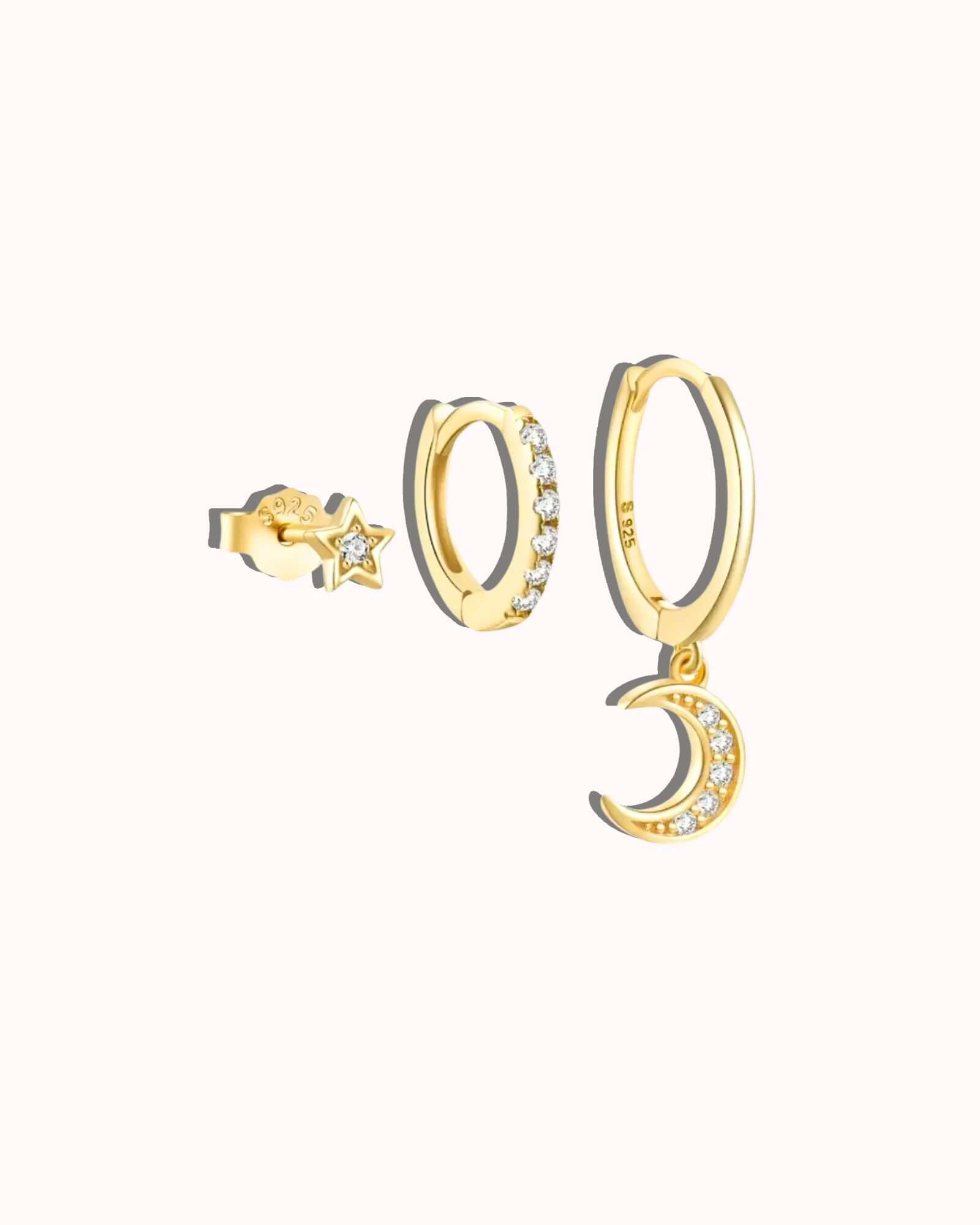 Three piece Lunaria earring set featuring gold hoops and a star and moon design with zircon inlay.