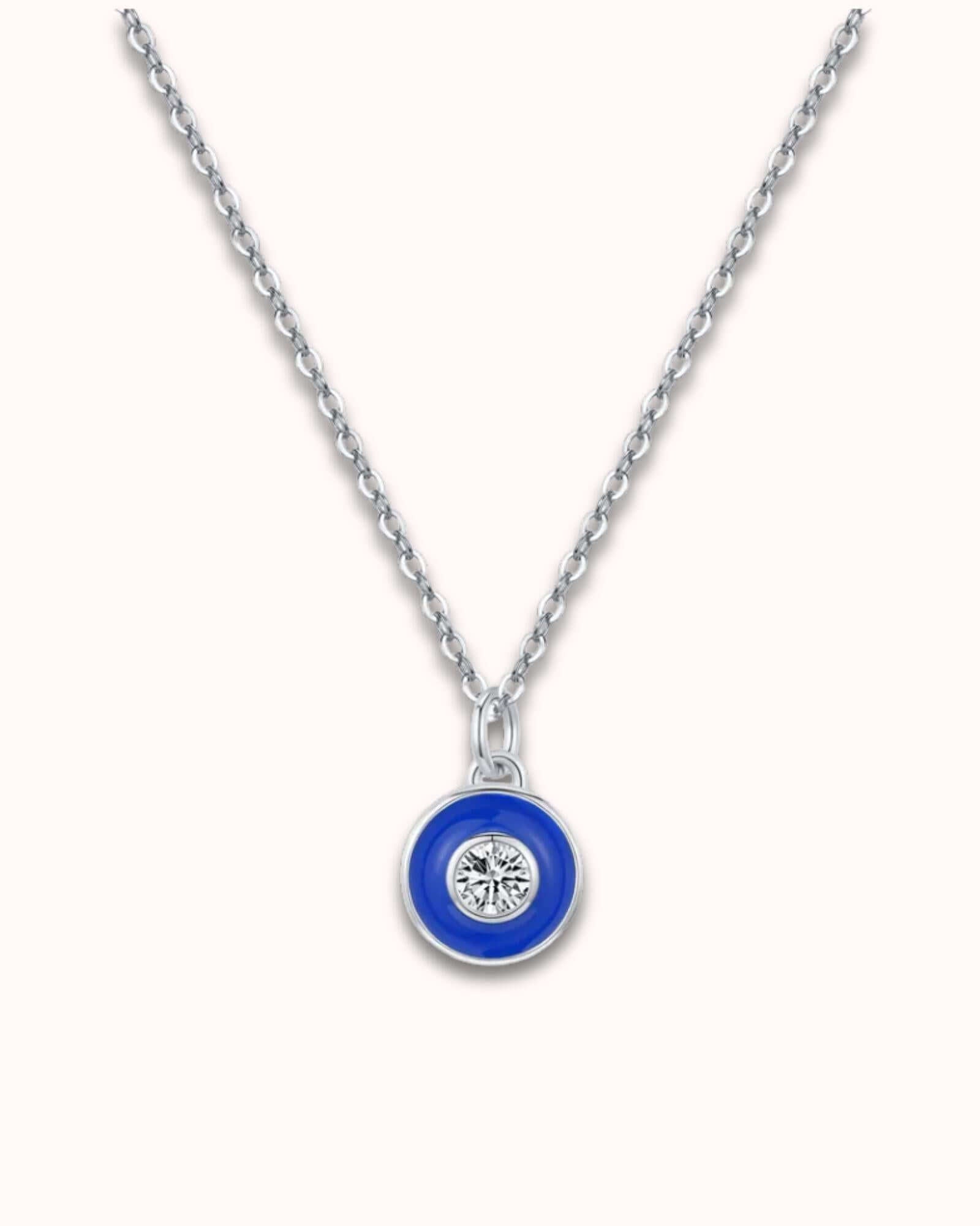 Vintage Devil's Eye pendant necklace featuring a blue motif and diamond on a sterling silver chain.
