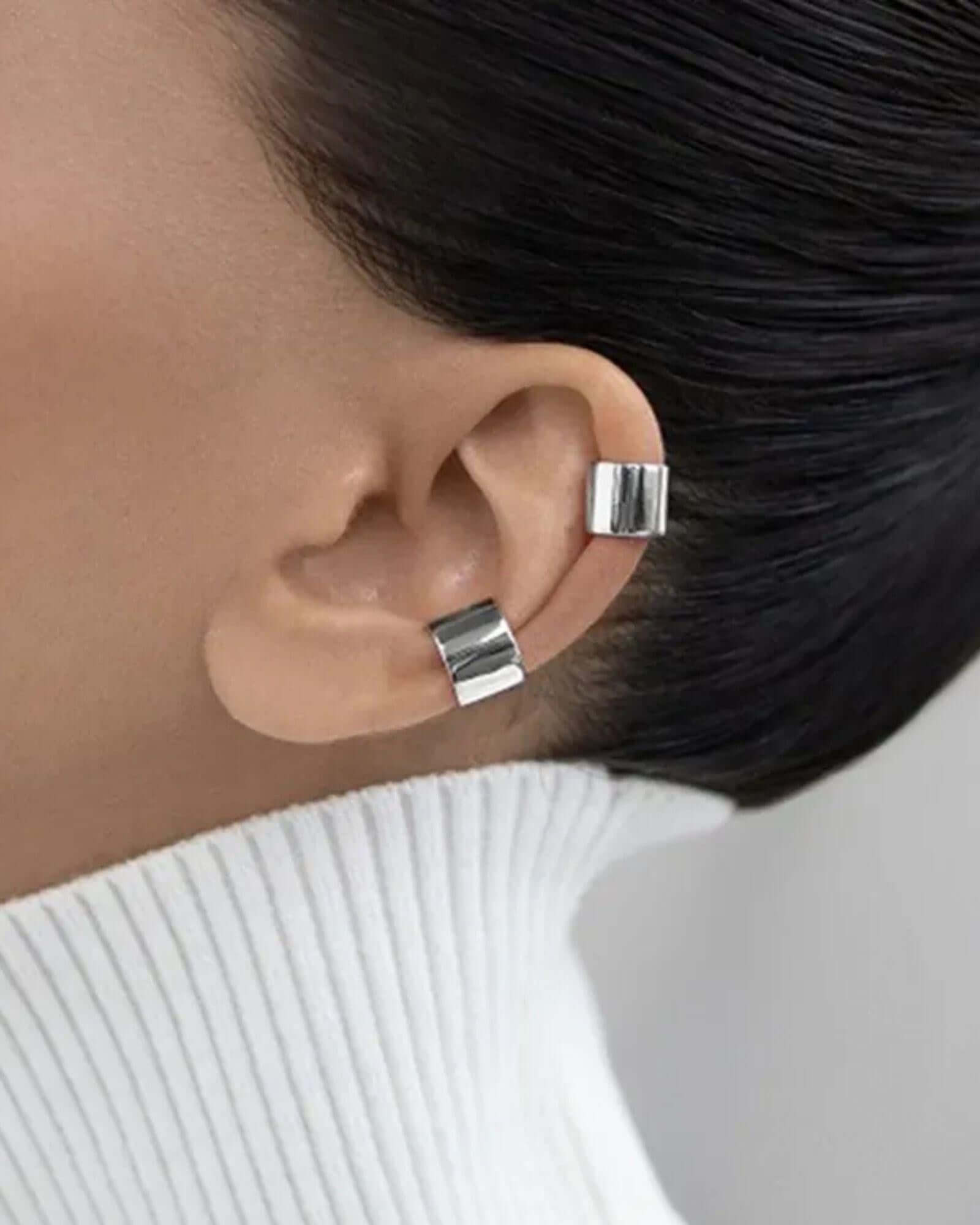 Close-up of an ear wearing silver ear cuff