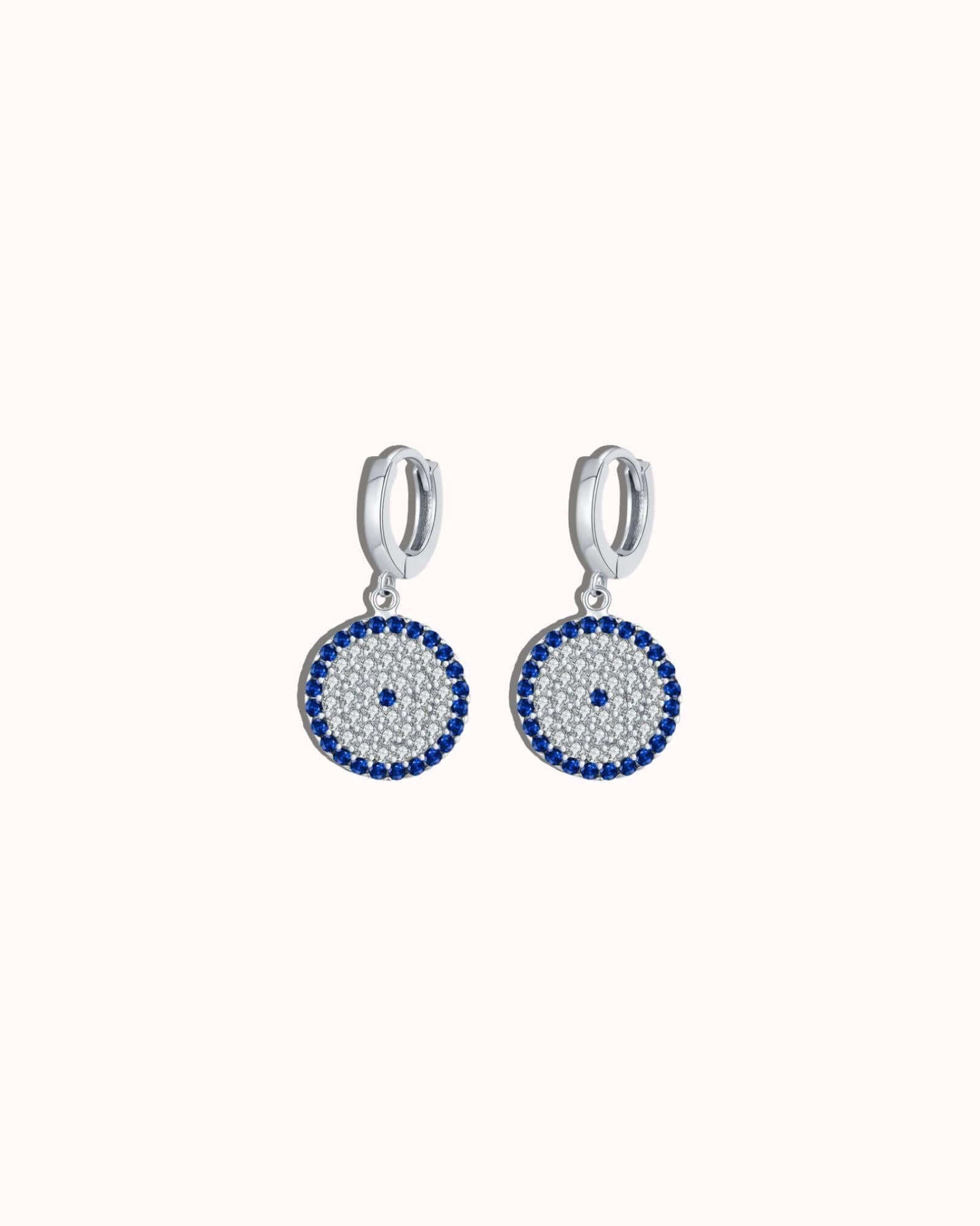 Circle Evil Eye Earrings in silver with blue zircon inlay, polished Rhodium-plated design, lightweight and stylish.