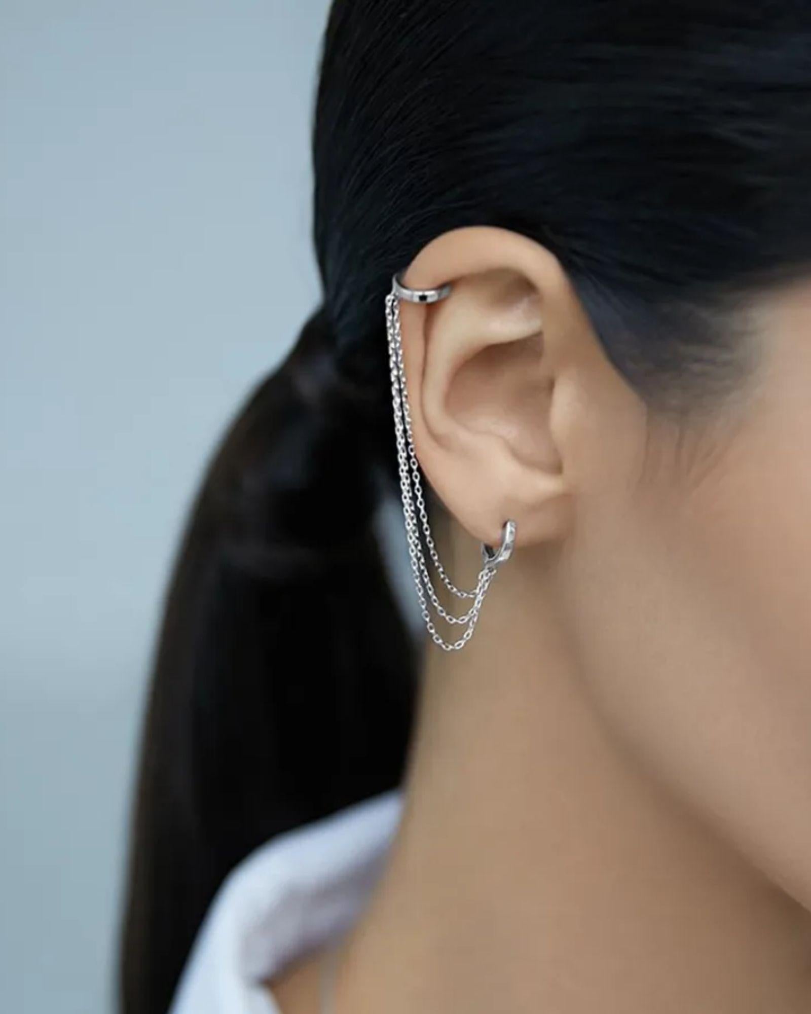 Stylish Ear Chain Cuffs in 925 sterling silver worn on the ear, showcasing elegant design and modern fashion.