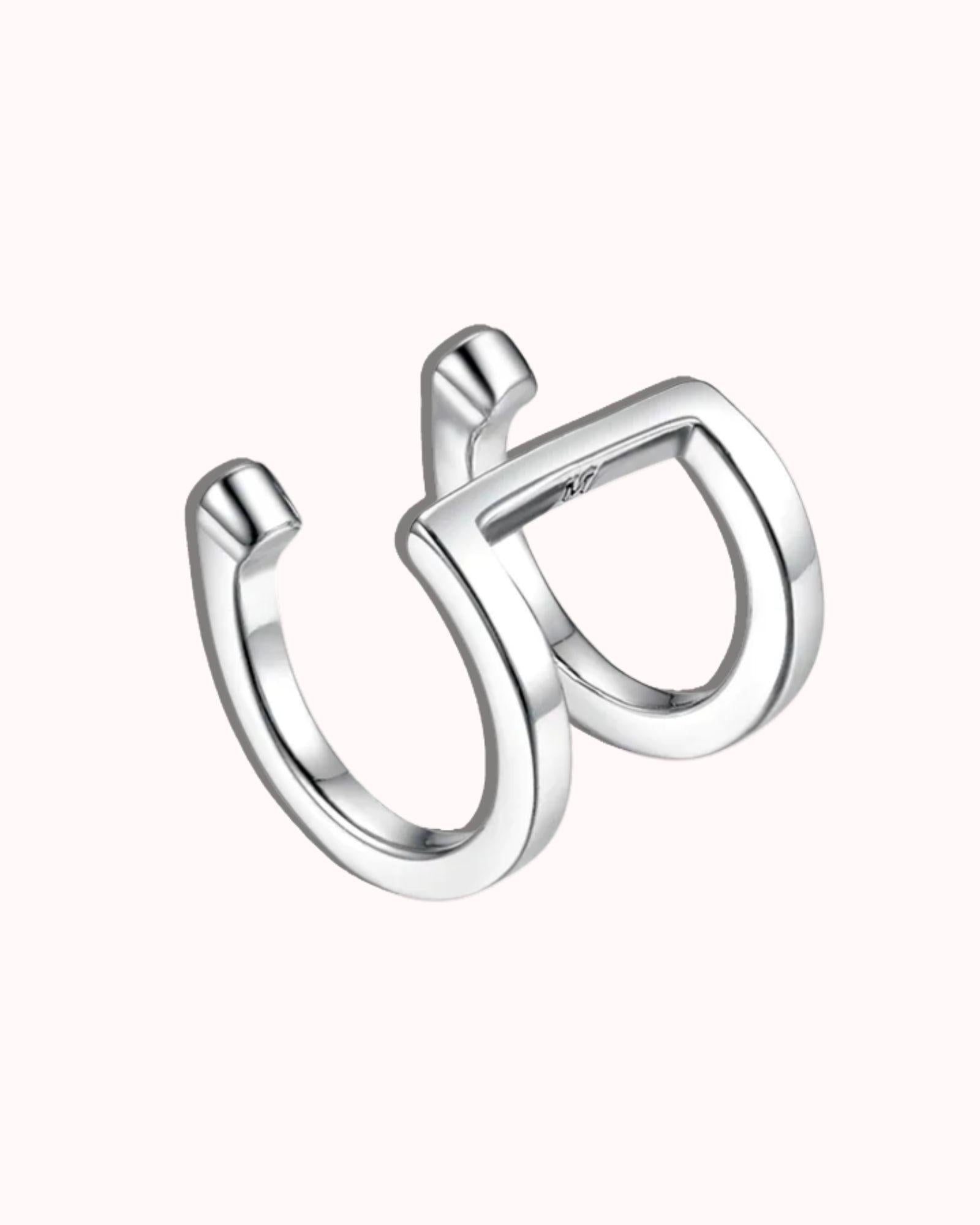 Double band ear cuff in silver featuring a minimalist geometric design and sleek finish.
