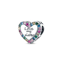 Heart-shaped charm with 'Love my sister' text and multicolored stones on a white background