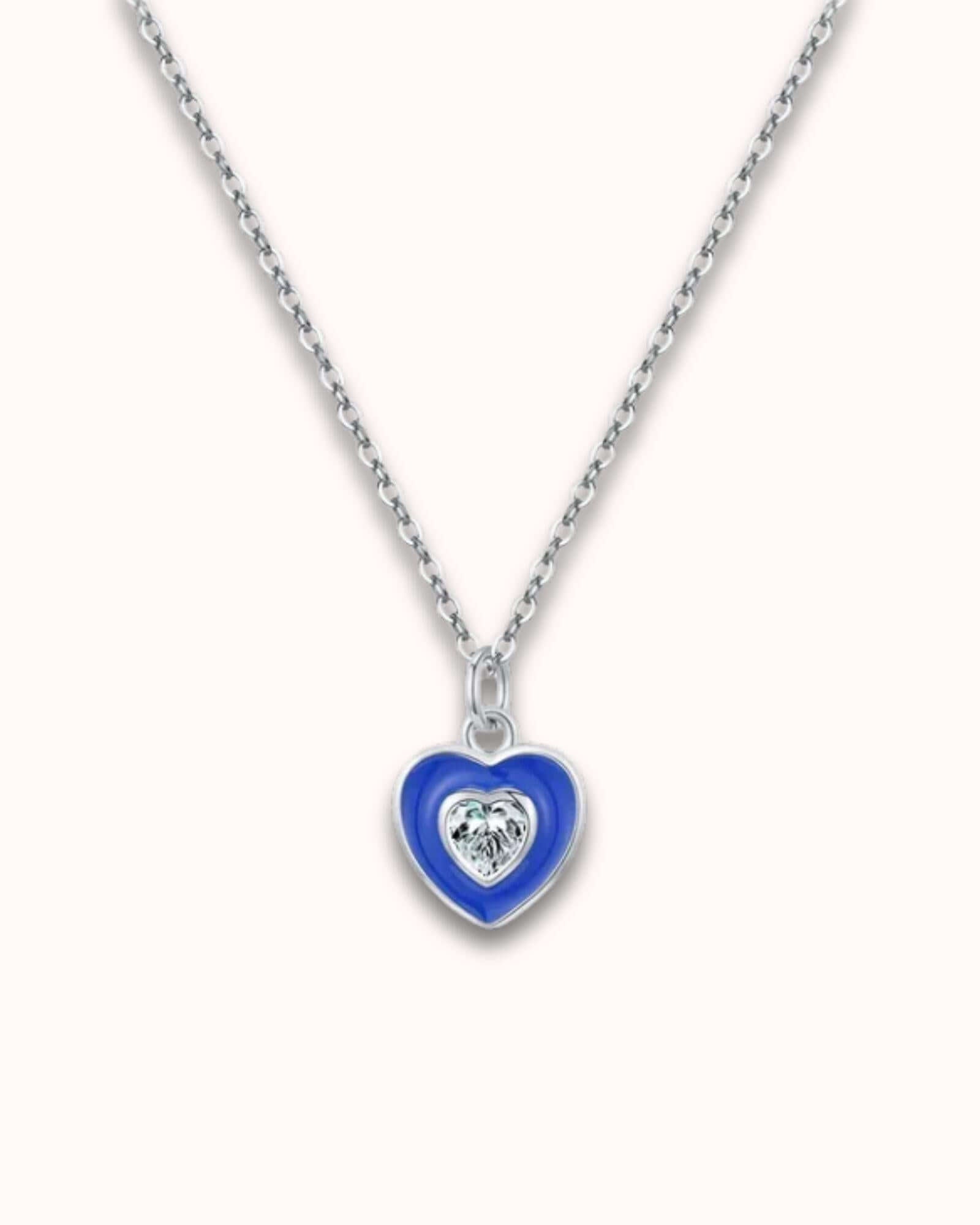 Heart Devil's Eye Pendant Necklace featuring a blue heart design and diamond detail on a sterling silver chain.