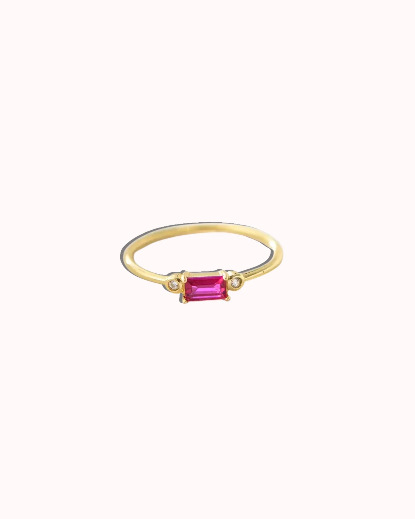 Viola Ring featuring a ruby red stone set in 18k gold plating, showcasing timeless elegance and vibrant color.