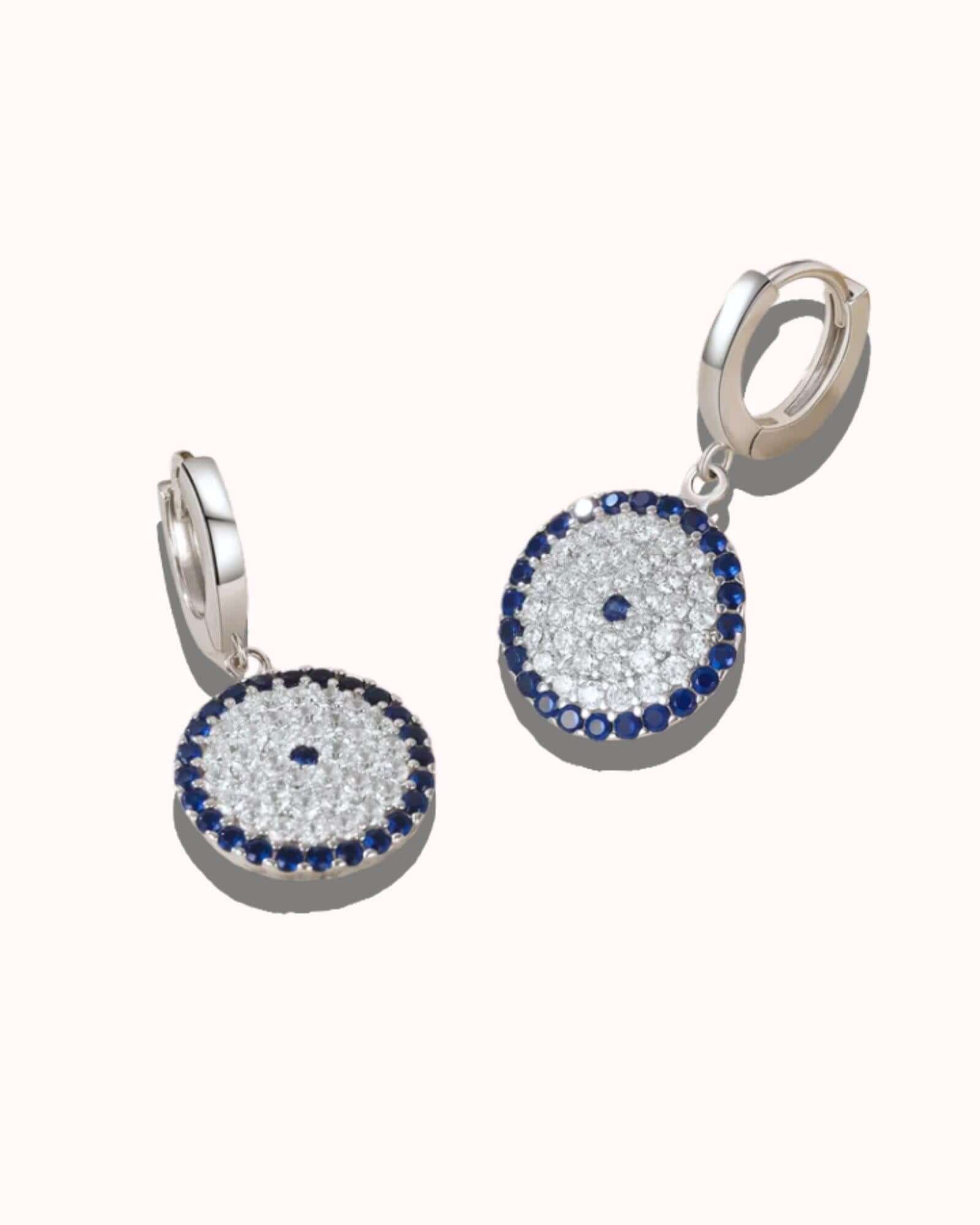 Circle evil eye earrings in silver with zircon inlay, stylish lightweight design for any occasion.