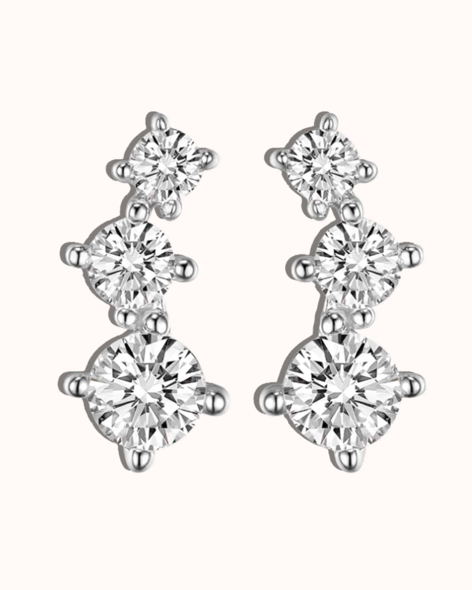 Elegant rhombus stud earrings in Silver with sparkling diamonds to enhance your style.