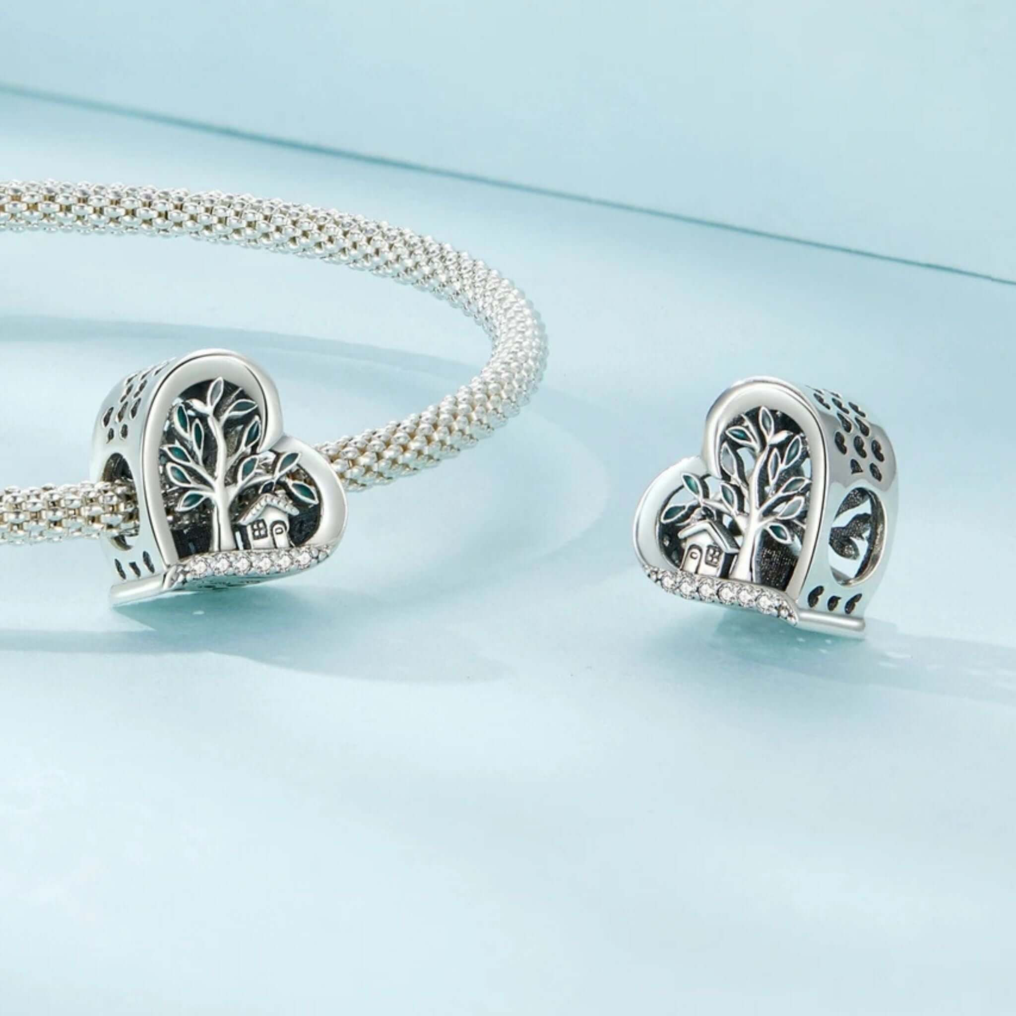 Tree of Life charm in sterling silver on bracelet, symbolizing vitality and affection with cubic zirconia accents.