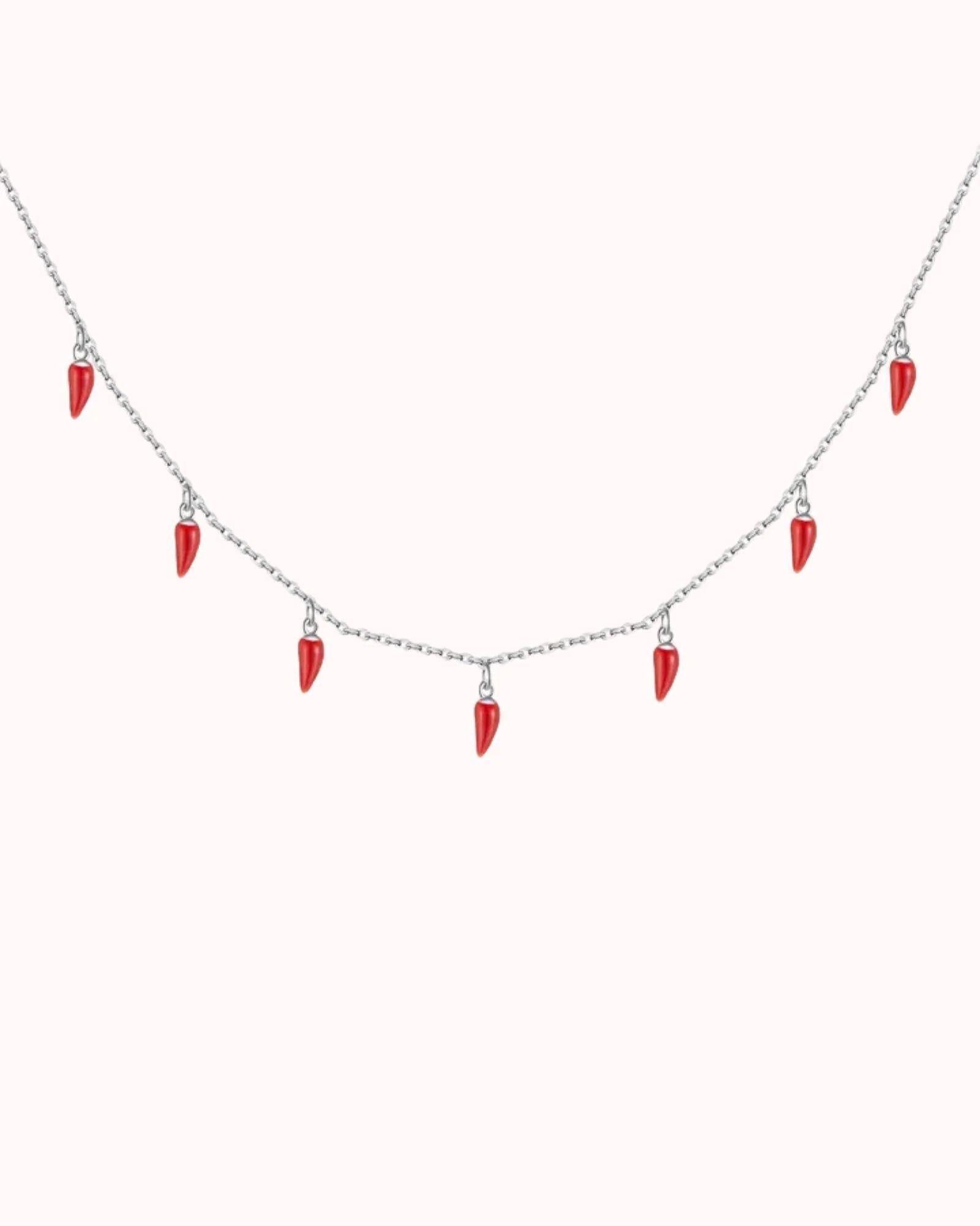 Spicy Bloom Chilli Charm Necklace featuring red chilli charms on a delicate silver chain.