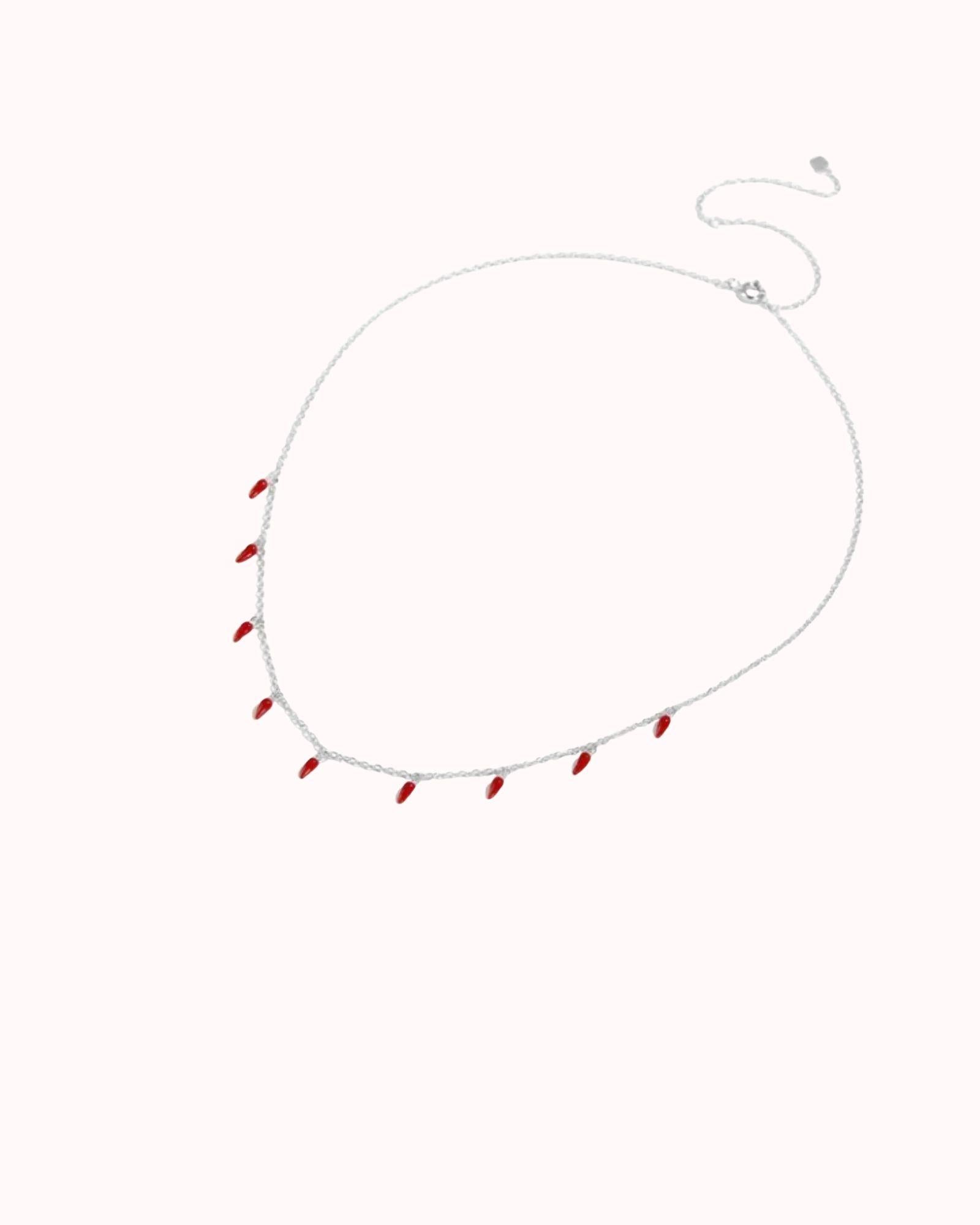 Spicy Bloom Chilli Charm Necklace featuring delicate chilli charms on a silver chain.