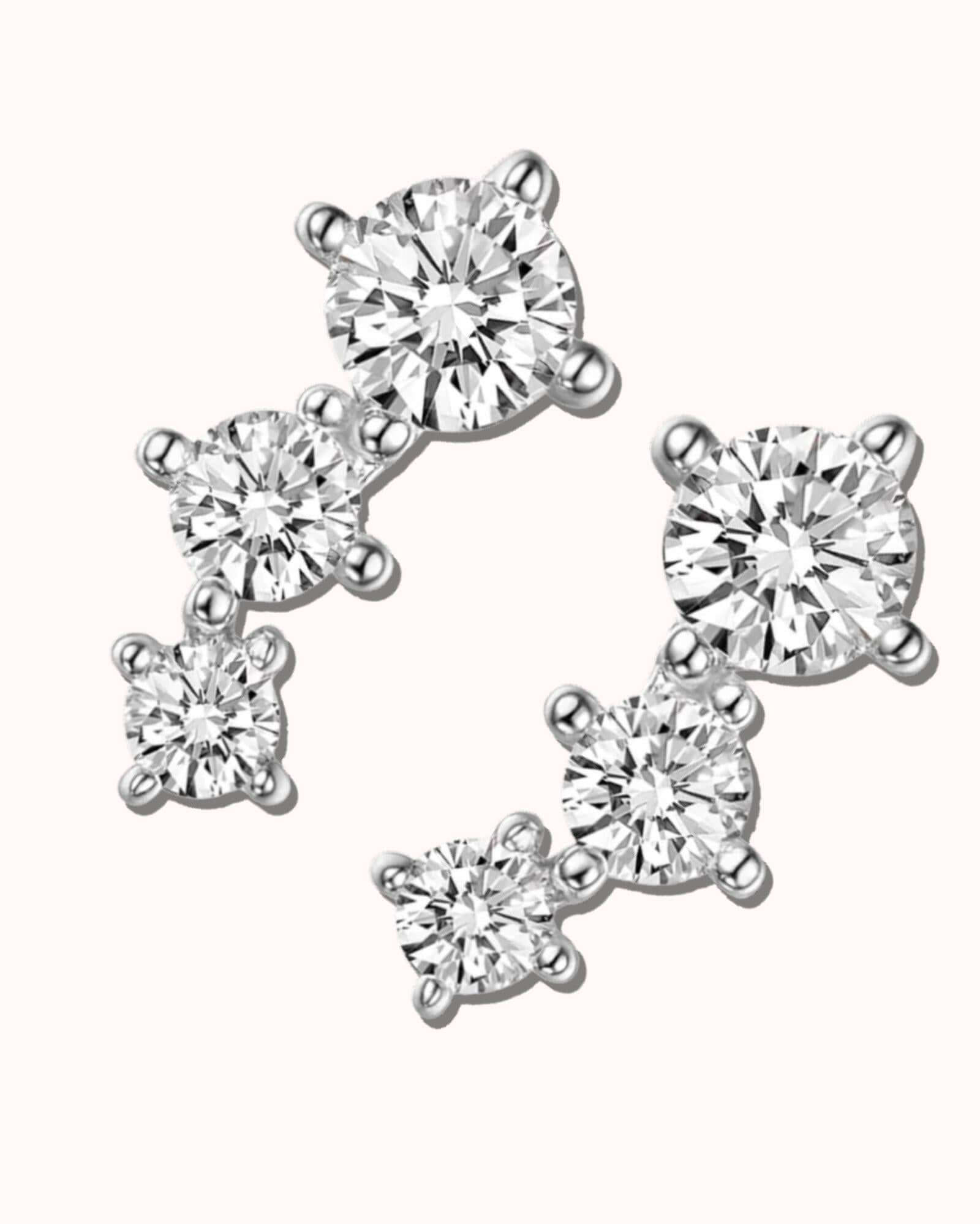 rhombus stud earrings in Silver showcasing sparkling diamond-like stones arranged elegantly.