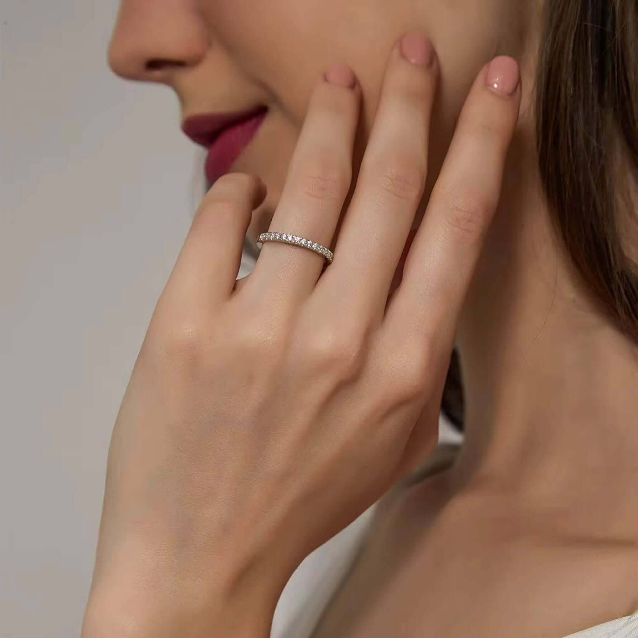 Model showcasing a Half Eternity Stackable Ring in Silver with zircon accents on her finger.