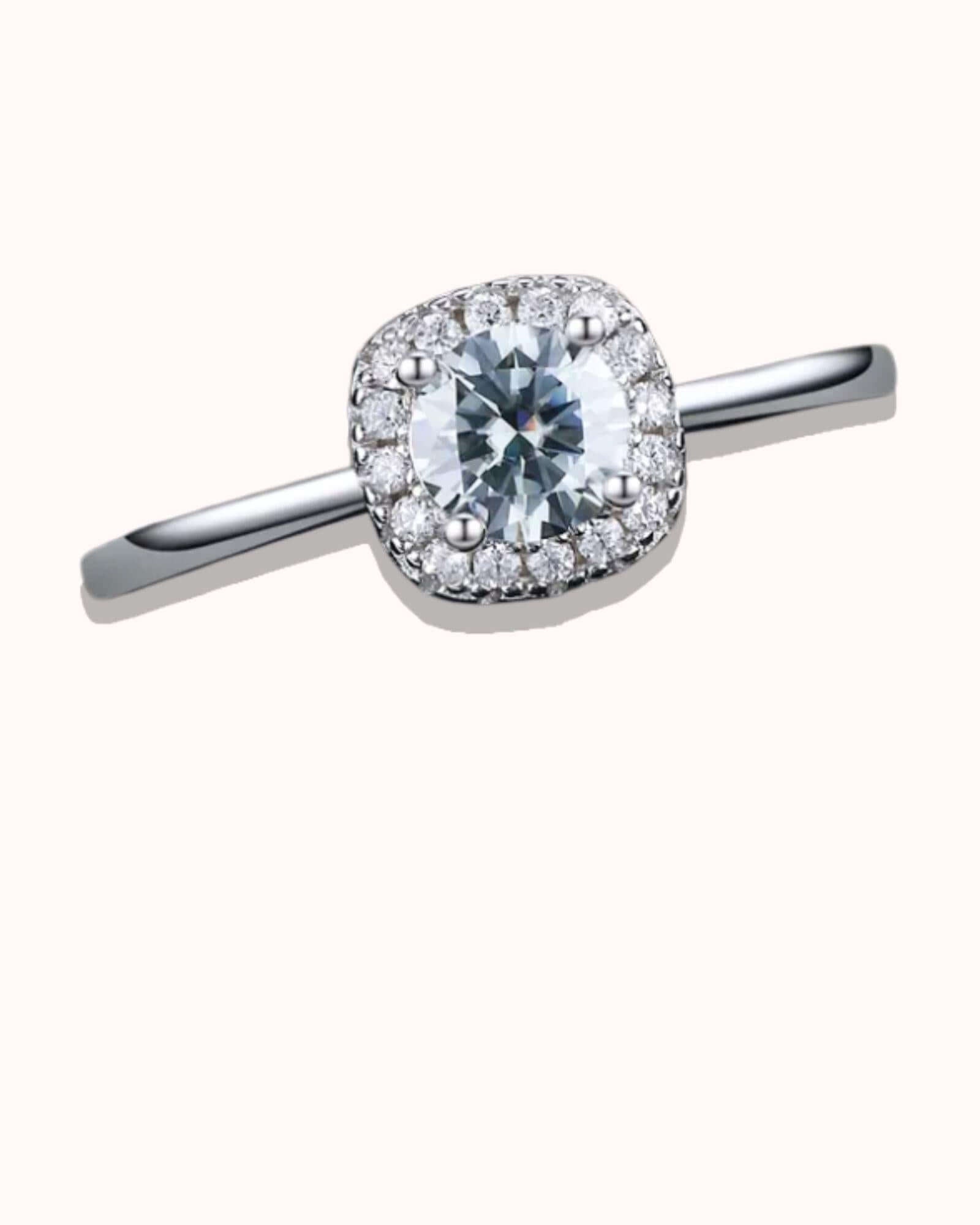 Diamond ring with a halo on a white background