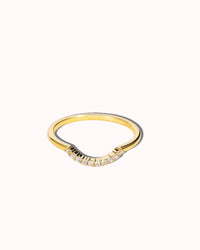 Gold ring with small diamonds on a white background