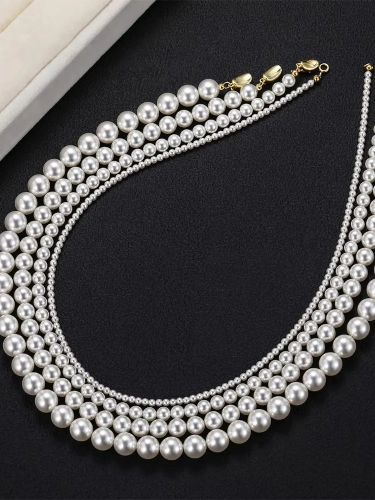 Elegant white pearl vintage choker necklace with multiple strands, featuring 925 sterling silver details.