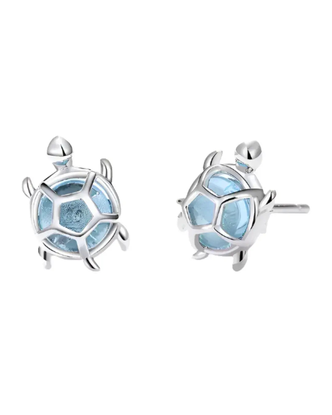 Turtle-shaped earrings with light blue artificial stone on a white background