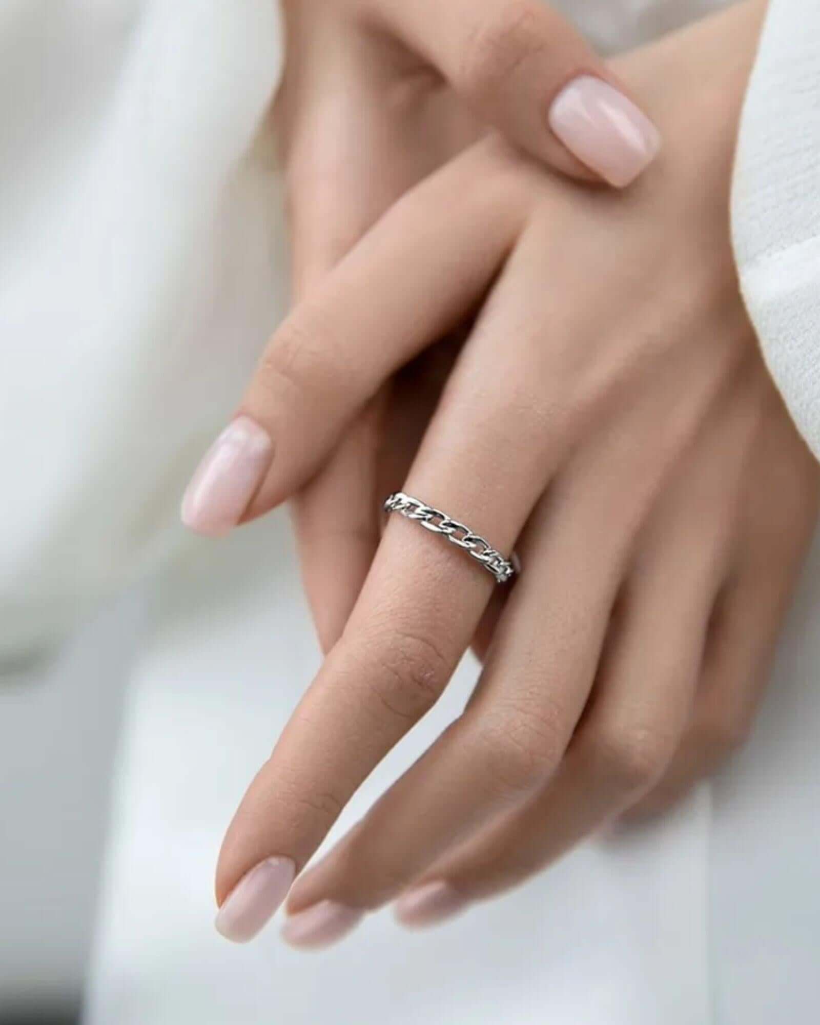 Linked Grace silver ring displayed on a model's hand, showcasing its delicate chain-inspired design.