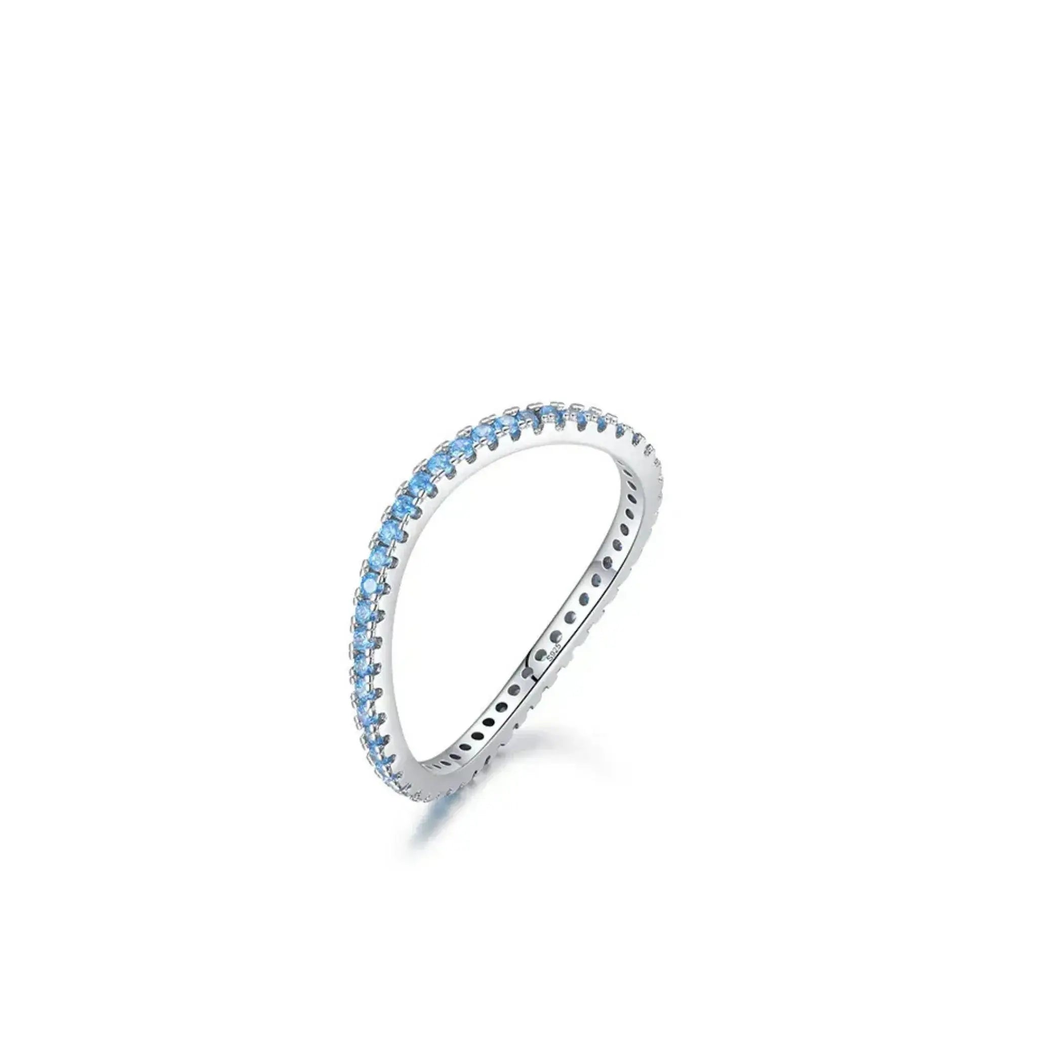 Silver ring with blue gemstones on a white background