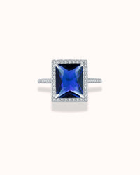 Radiant cut blue zirconia cocktail ring in sterling silver, featuring sparkling rhodium plating.