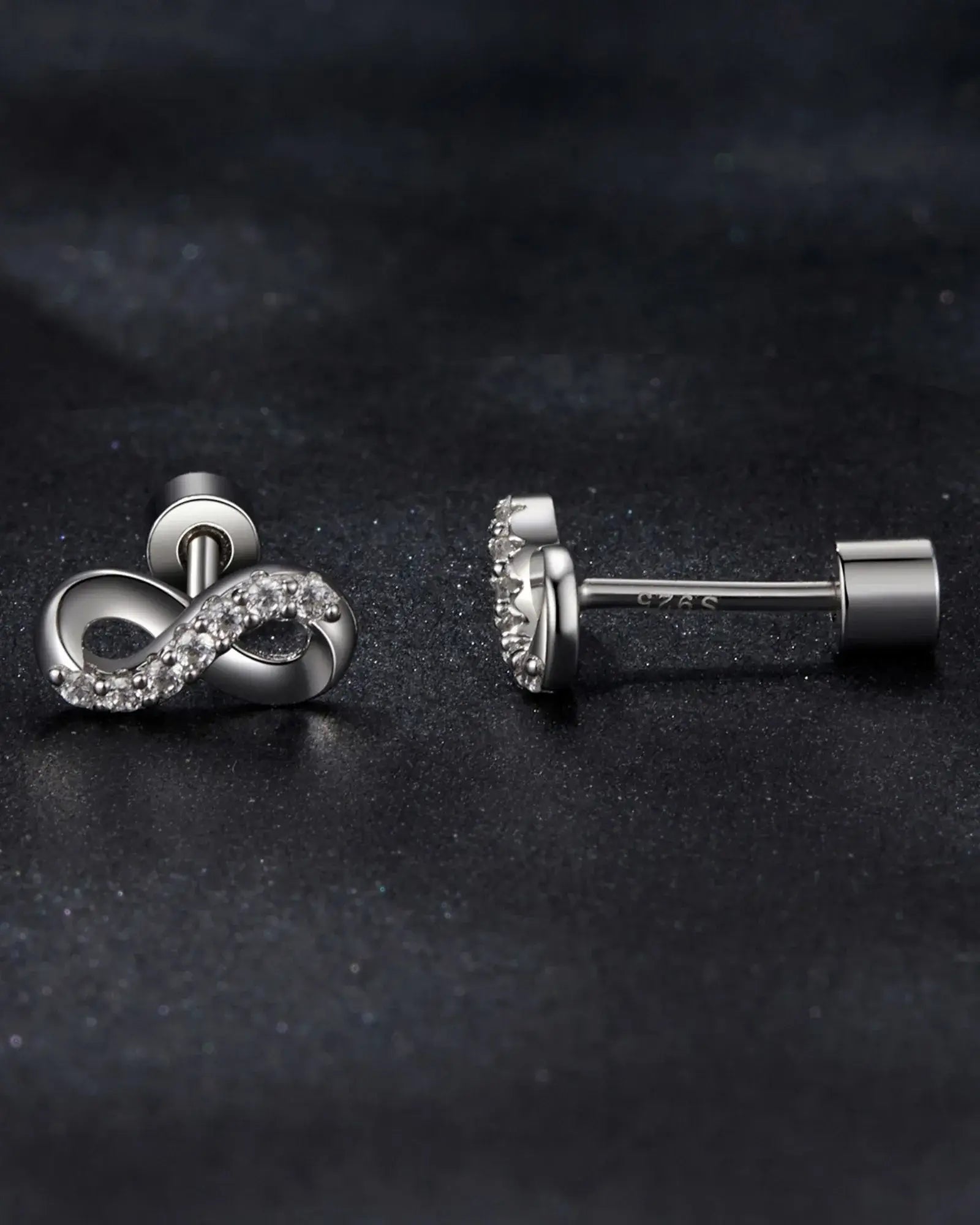 Sophisticated infinity ear studs in 925 sterling silver, featuring moissanite inlay and secure screw back design.