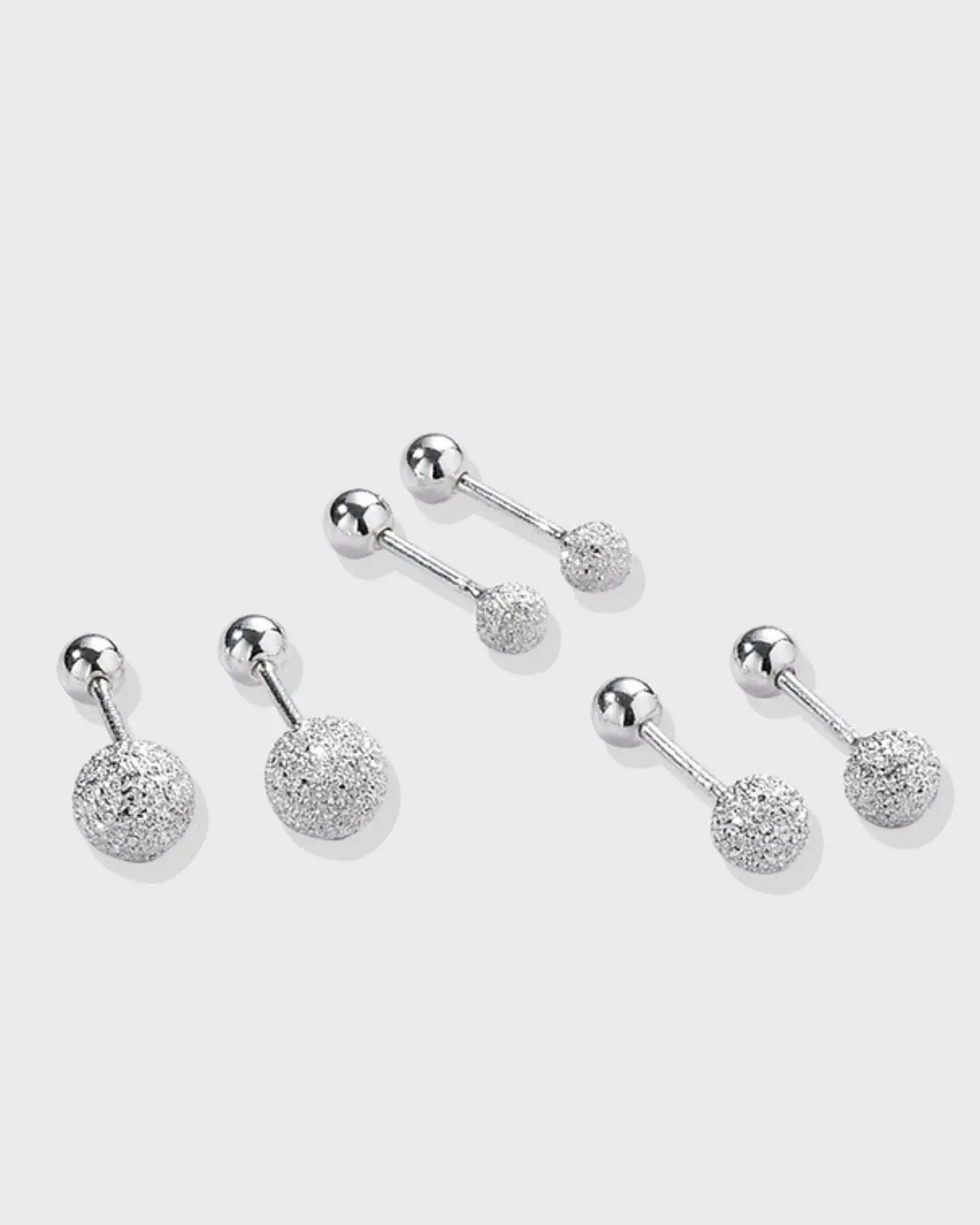 Luna Frost Ear Studs featuring silver-tone design with frosted crystal spheres for a minimalist and radiant look.