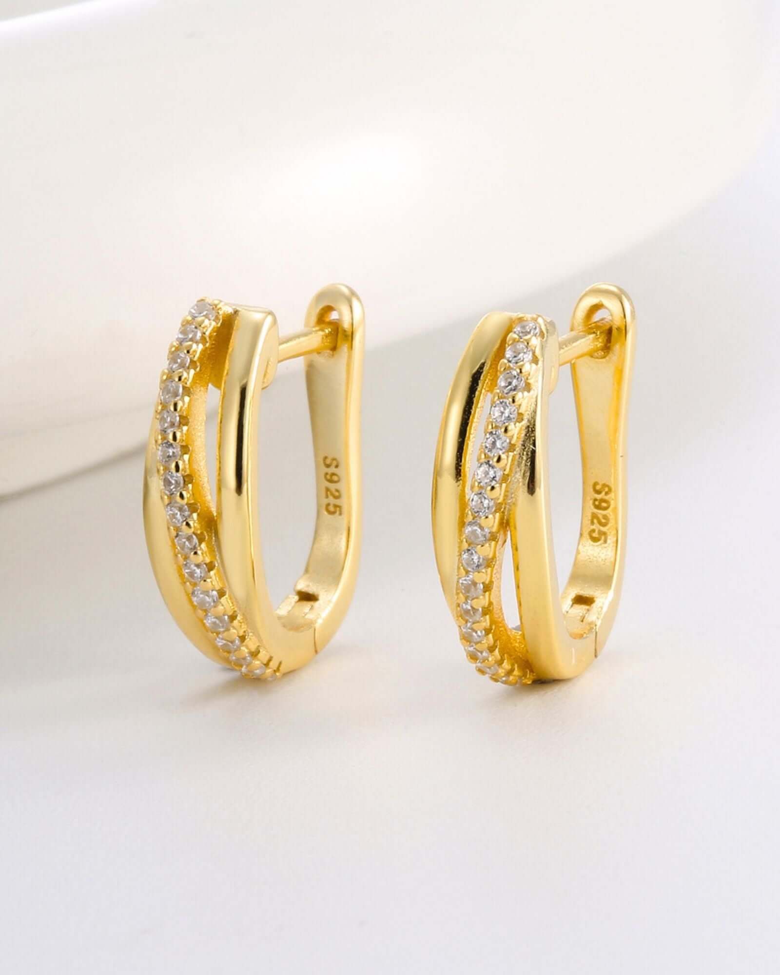 Lux Hoop Earrings in 18k gold plating with cubic zirconia, featuring a triple hoop twist design for elegance.