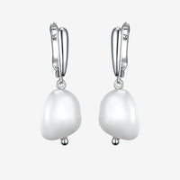 Lumera Pearl Hoops in 925 sterling silver with white gold plating and elegant pearls, a timeless accessory for any outfit.
