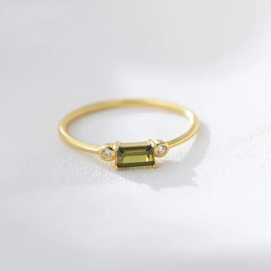 Viola Ring featuring a striking olive green zircon stone set in 18k gold plating, exuding elegance and charm.