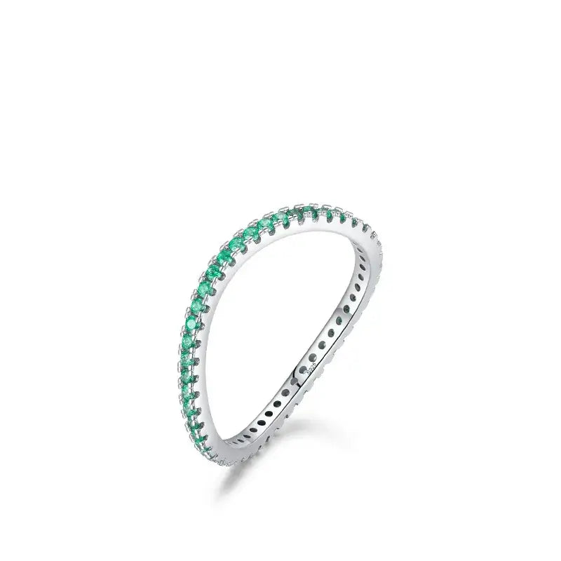 Emerald Glow Eternity Band in sterling silver with vibrant green zircon stones, elegant design for stacking or solo wear.