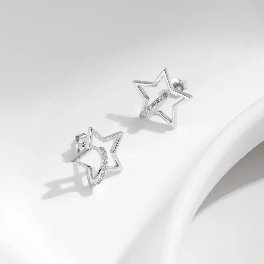Hollow star Ear studs with silver zircon inlay, crafted from 925 sterling silver with rhodium plating.