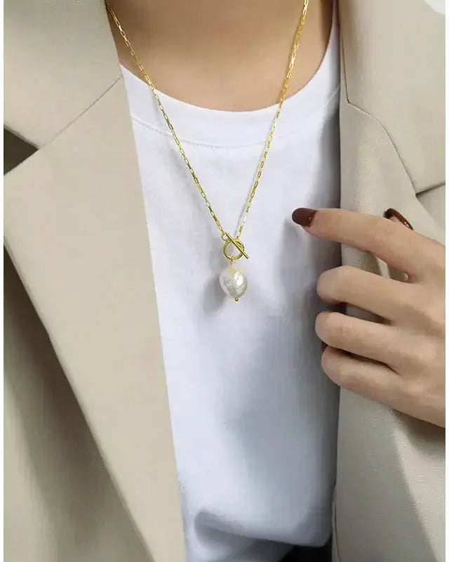 Elegant Lia Pearl Pendant Necklace in gold, featuring a lustrous pearl, perfect for any occasion.