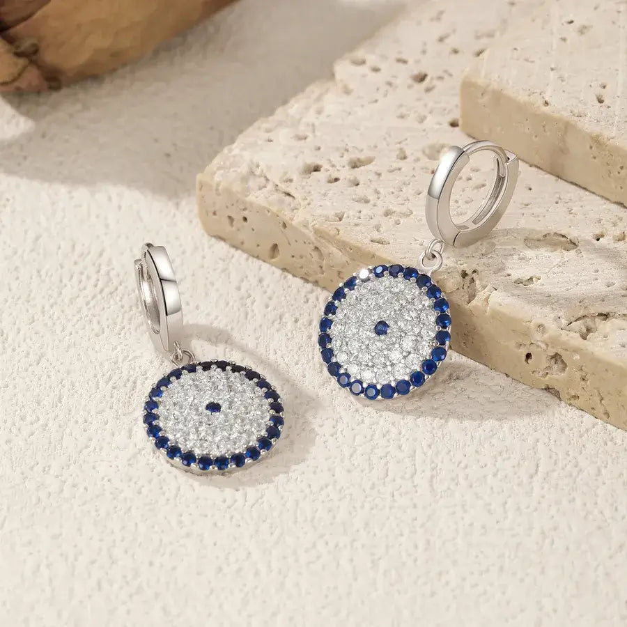 Circle Evil Eye Earrings in silver featuring a polished design with zircon inlay and lightweight comfort.