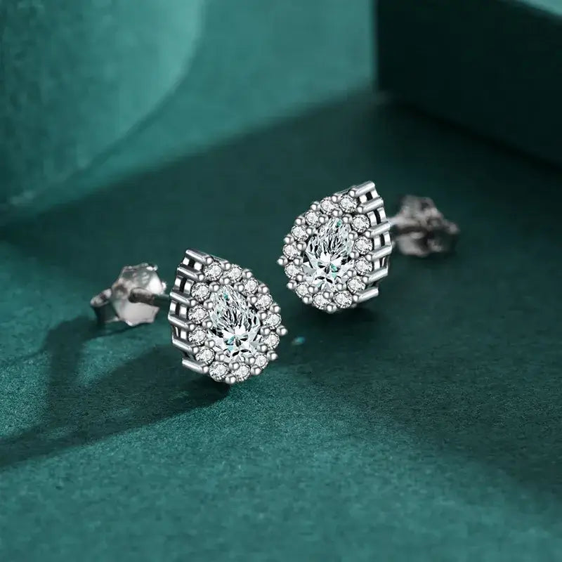 Sterling silver water droplets ear studs featuring zircon inlay, perfect for elegant daily wear.