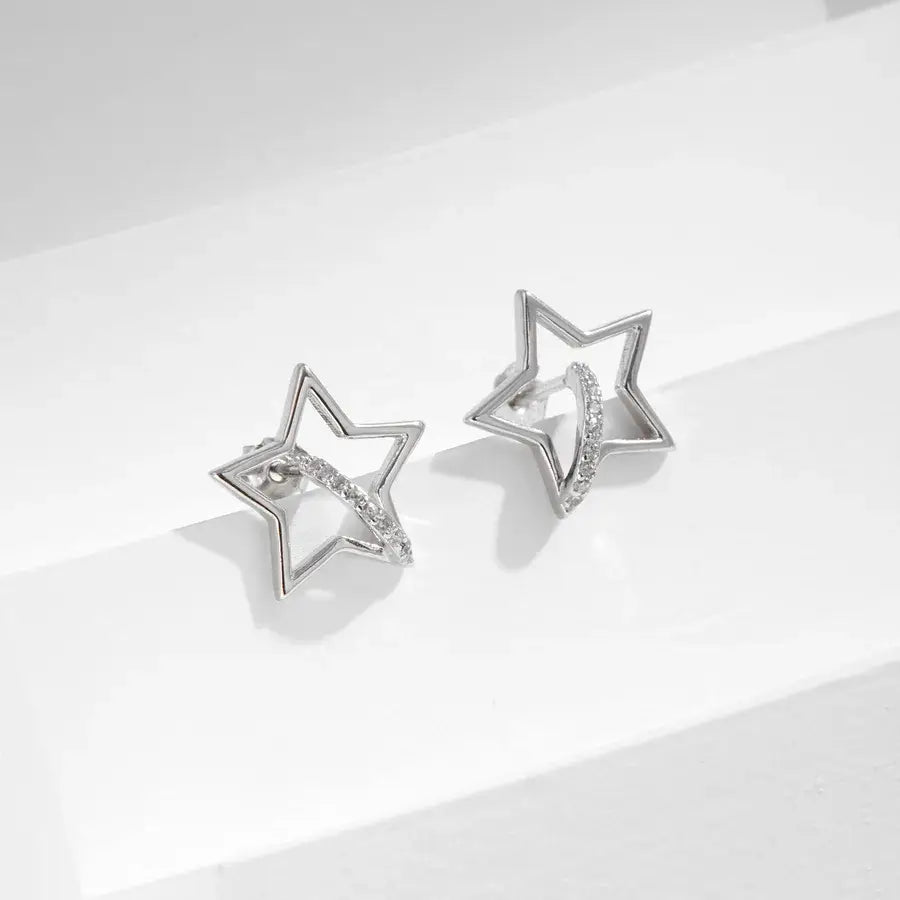 Hollow star Ear studs with silver zircon inlay, crafted from 925 sterling silver and rhodium plated.