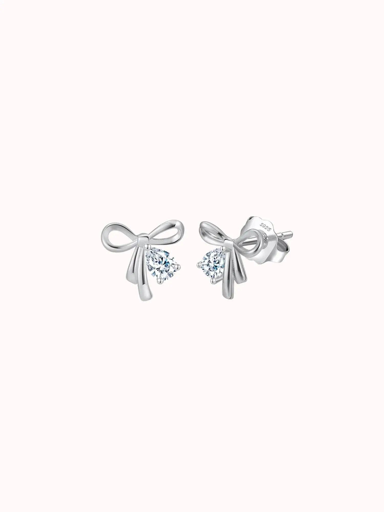 Minimalist rhodium plated bow knot stud earrings adorned with AAAAA zircon, perfect for everyday wear.