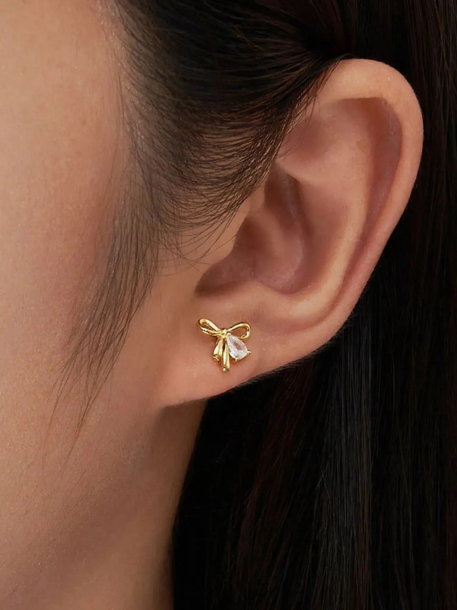 Gold Bow Knot Stud Earrings featuring AAAAA Zircon, perfect for everyday wear, showcasing a minimalist and romantic design.