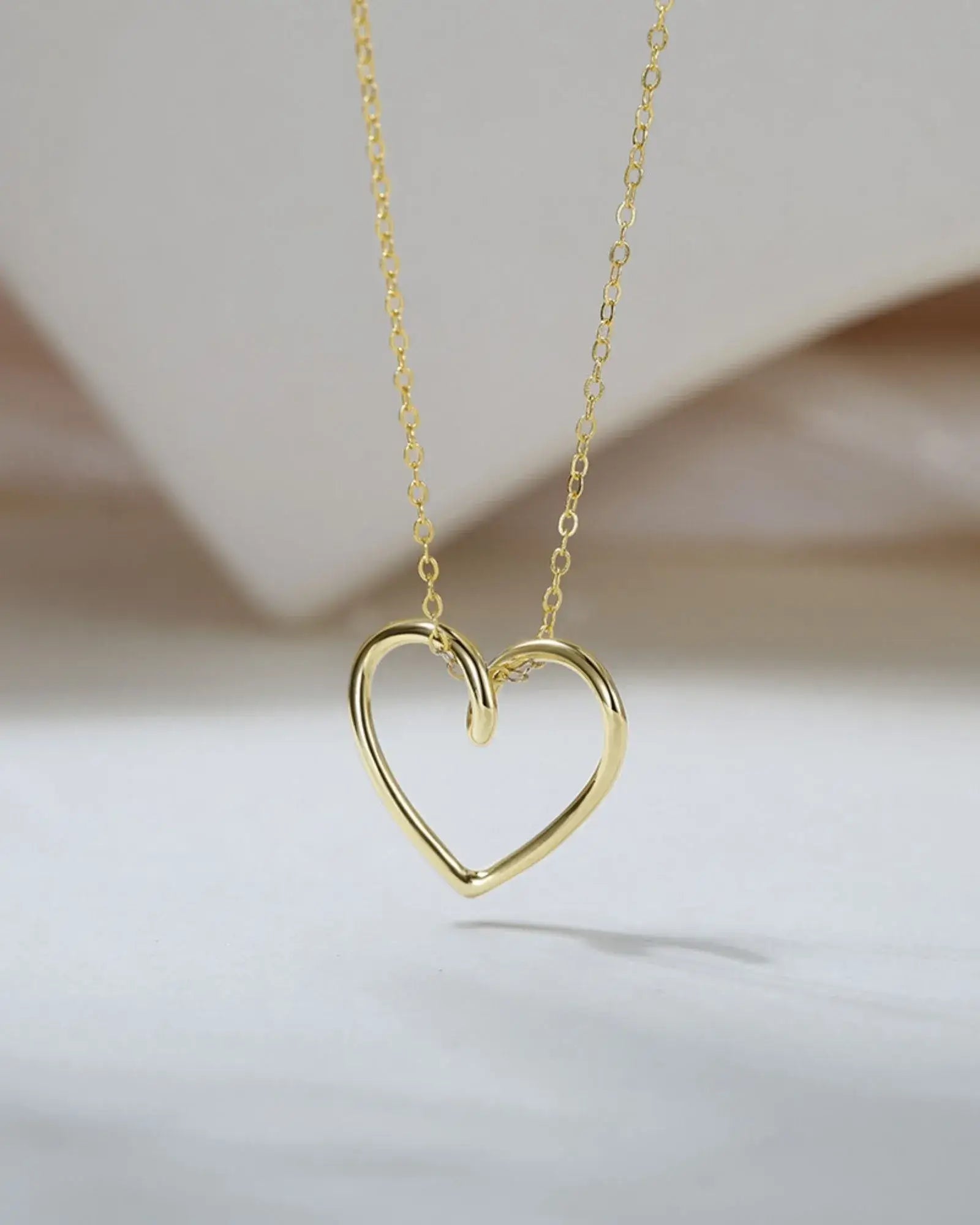 True Heart Pendant Necklace in 18k gold plating, showcasing a refined, sculptural heart design.