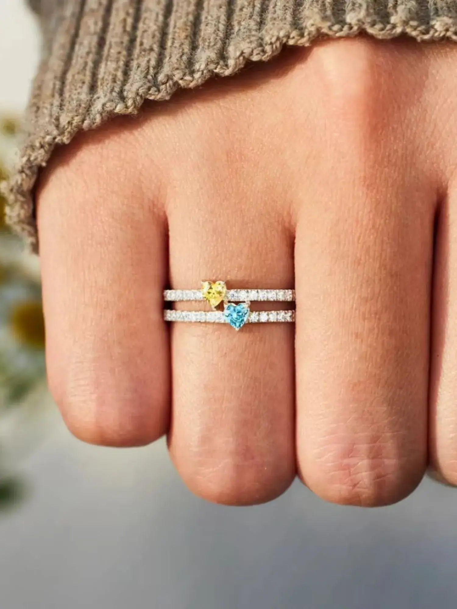 Two Heart Colourful Zircon Ring showcasing yellow and blue zircon stones, set in a delicate 925 sterling silver band.