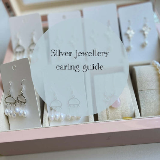 A collection of pearl earrings and necklaces made in sterling silver displayed in a luxurious jewellery box