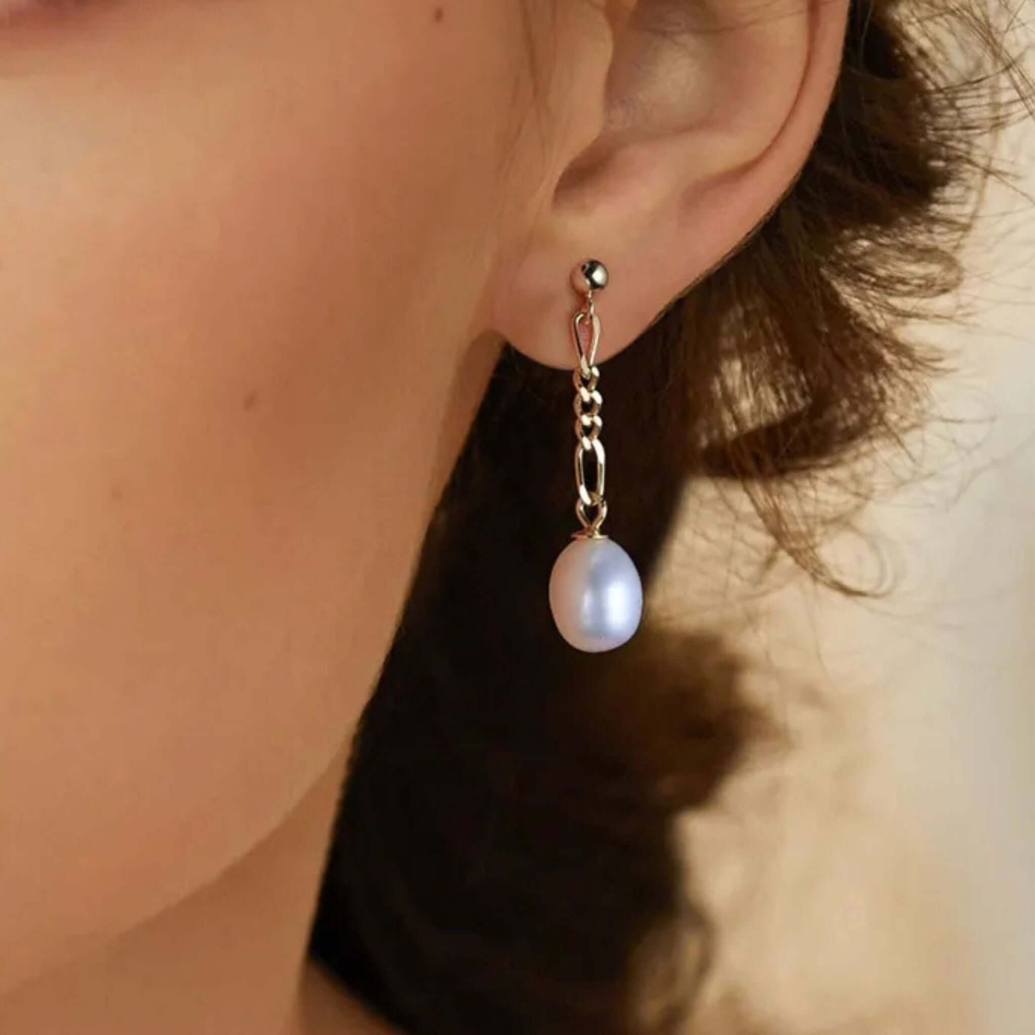 Elegant sterling silver pearl earrings showcasing a beautiful drop design, perfect for any occasion.