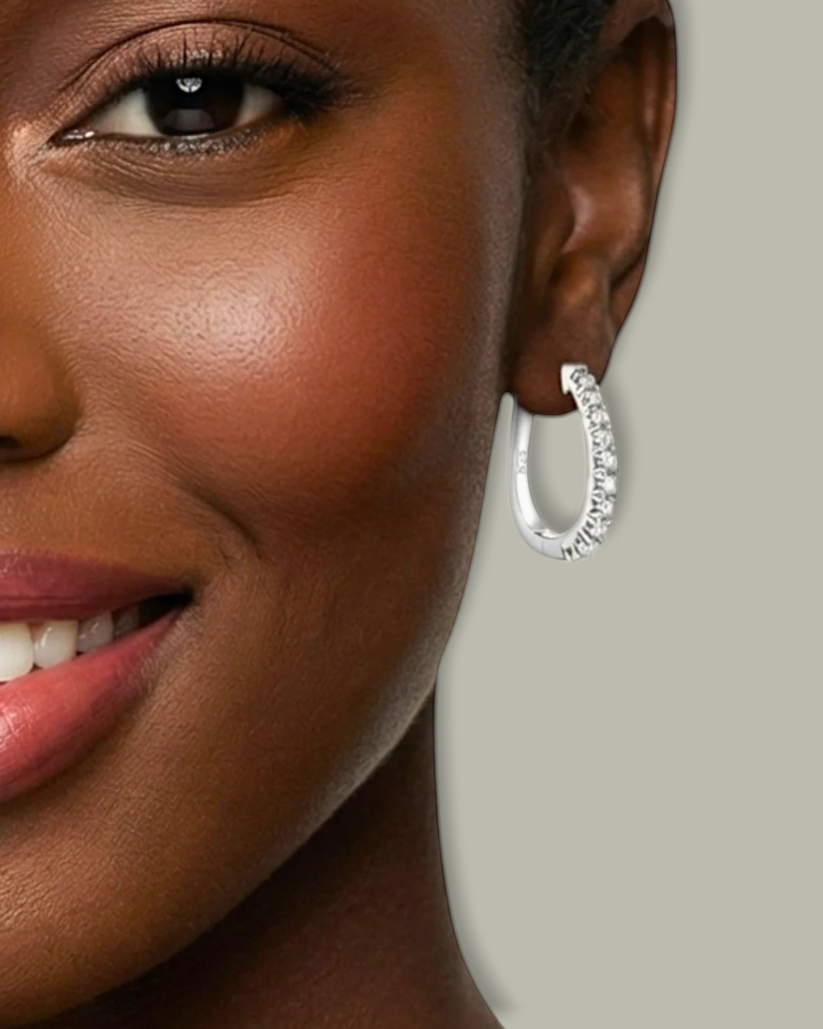0.5 Ct U shaped Moissanite Hoops worn by a smiling woman, showcasing elegance and sparkle.