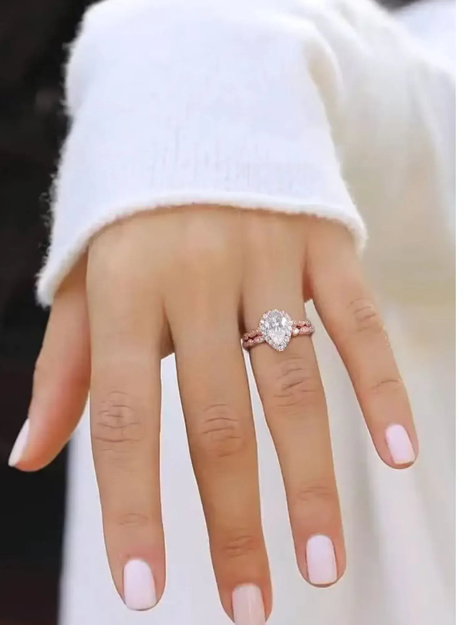 Hand wearing a 1.5CT Teardrop CZ Two Ring Set, showcasing elegant cubic zirconia in a prong setting on sterling silver.