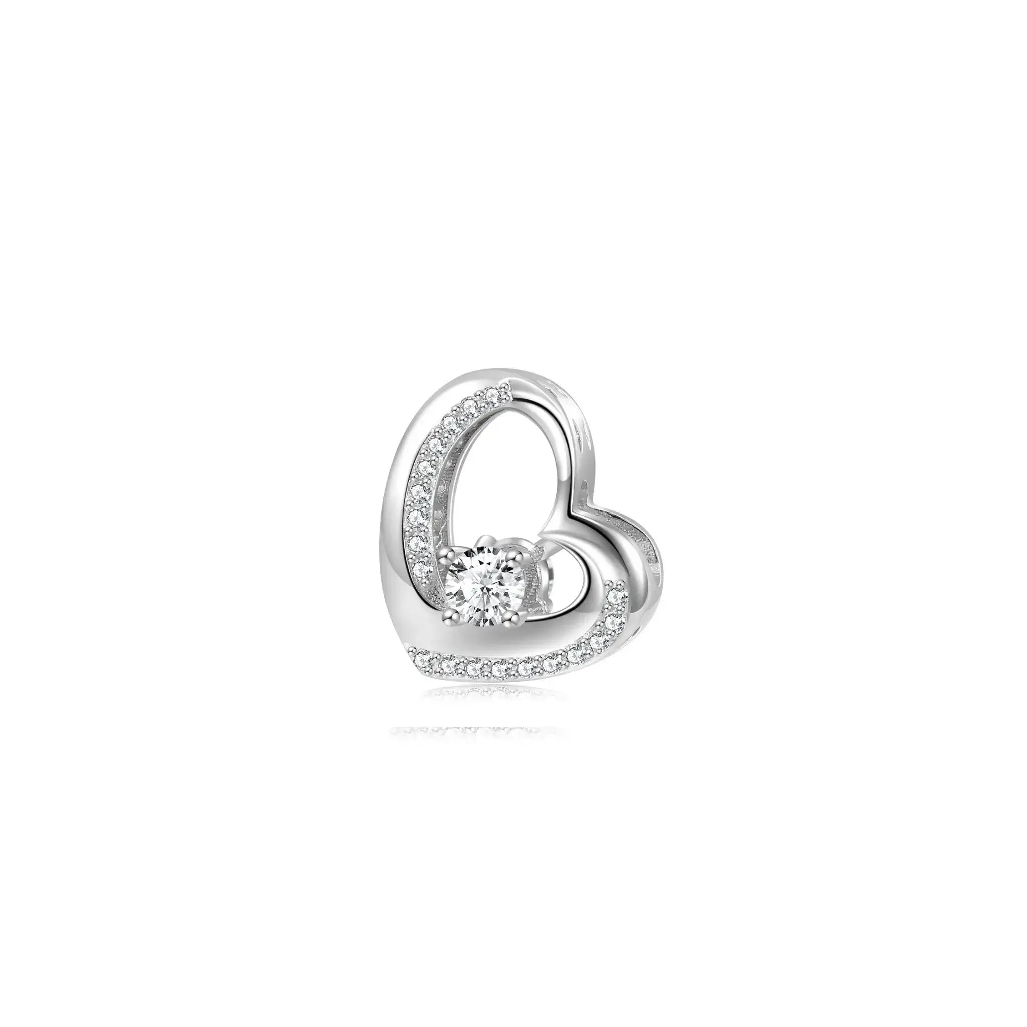 Silver heart-shaped earring with a central gemstone on a white background