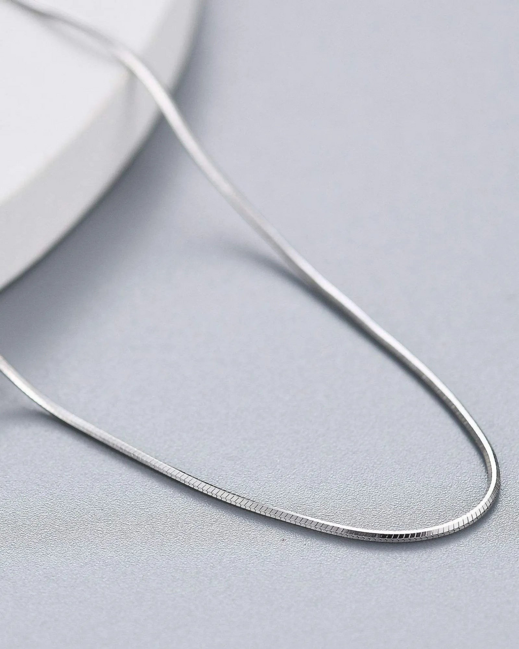 0.8mm Sided Snake chain made of premium 925 sterling silver, featuring a sleek design and platinum finish.