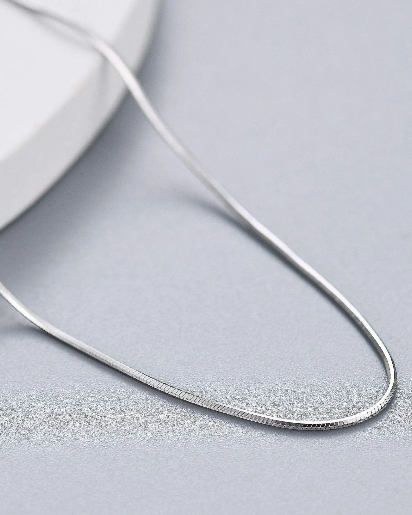 0.8mm Sided Snake chain made of premium 925 sterling silver, featuring a sleek design and platinum finish.
