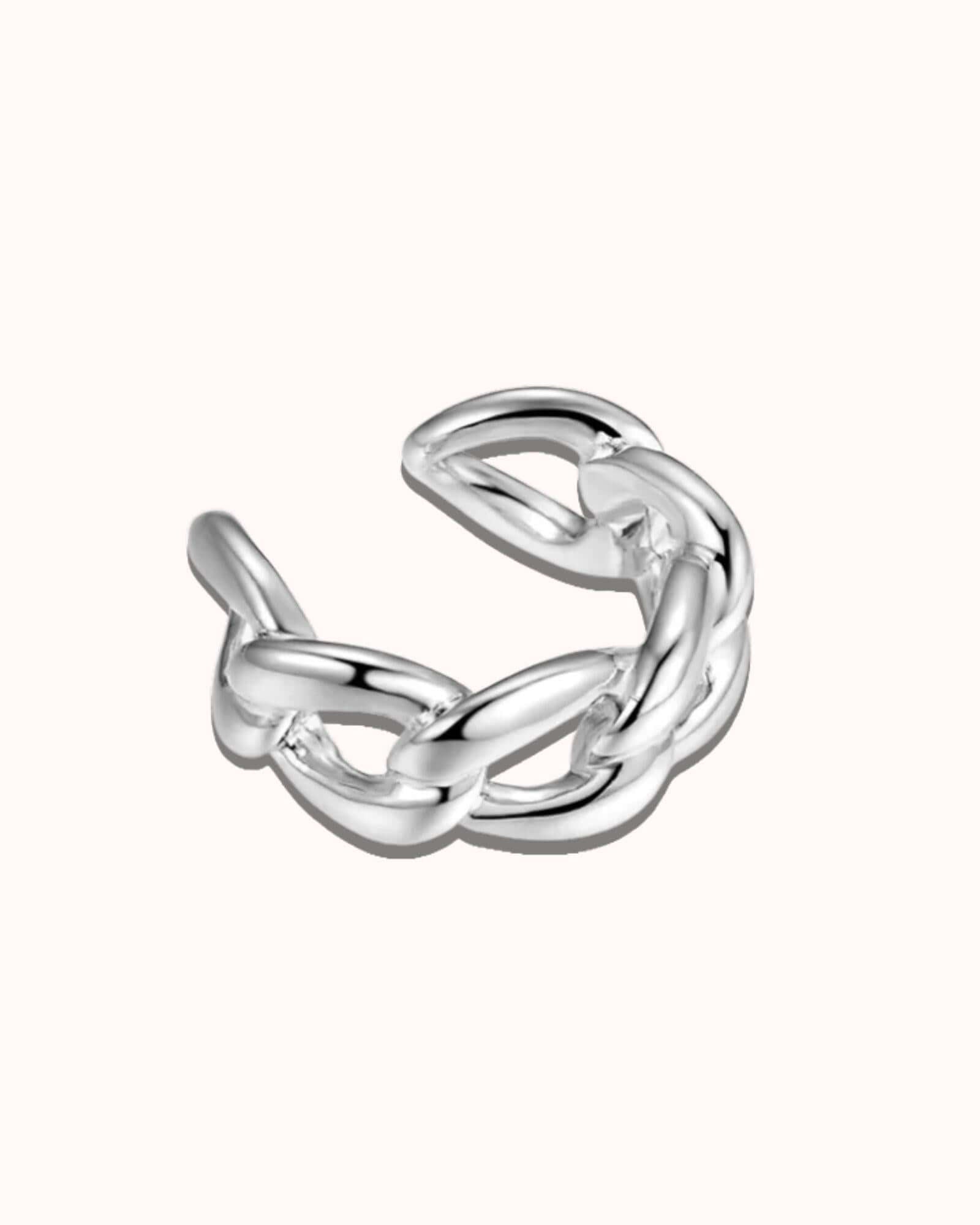 Silver knot ear cuff on a white background